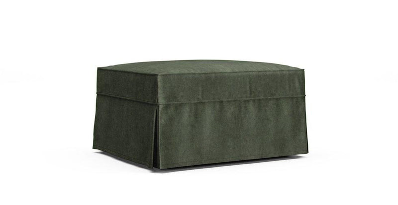 An Arhaus Baldwin Slipcovered Ottoman in a Signature Velvet Bayleaf cover
