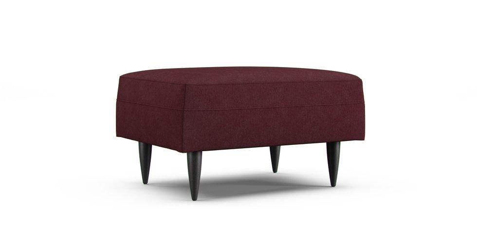 A Crate & Barrel Petrie Midcentury ottoman in a Everyday Weave Maroon cover