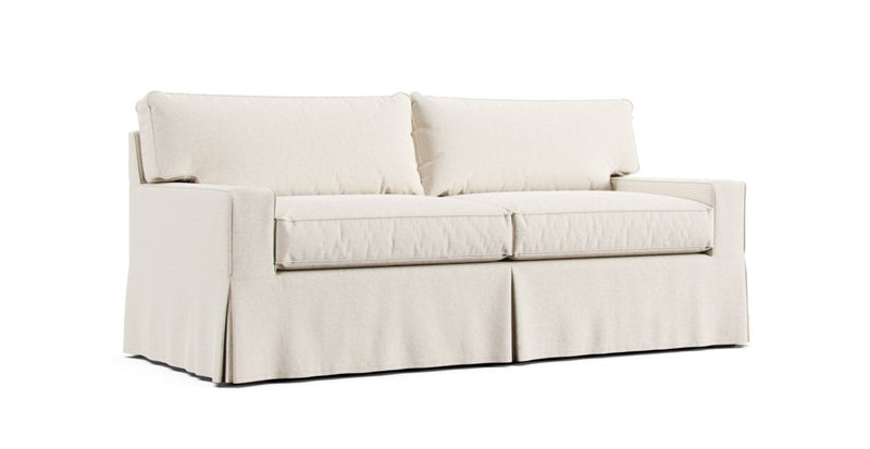 Mitchell Gold and Bob Williams Alex II sofa in a sand Brushed Cotton slipcover on a white background