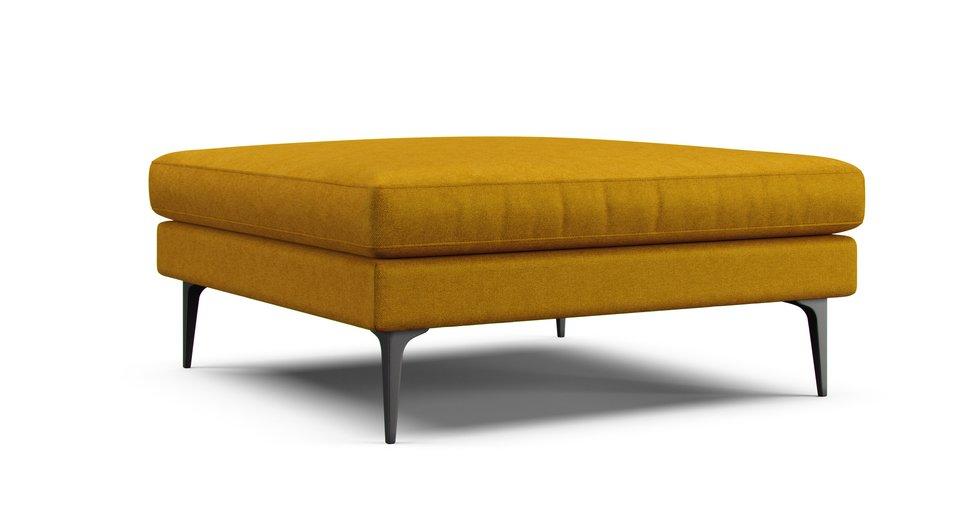 A West Elm Andes ottoman in an Eco Twill Amber cover