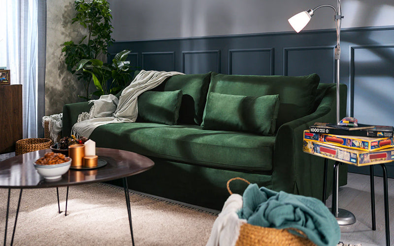 IKEA Farlov 3 seater sofa with easy clean and machine washable Classic Velvet Forest Green slipcover in a decorated living room