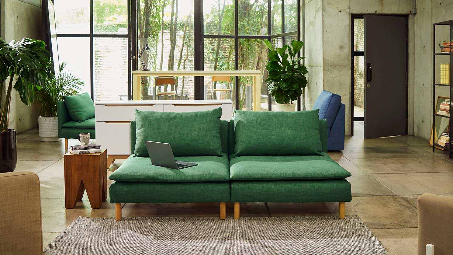 A basil green Textured Weave cover on a two seat IKEA Soderhamn section, in an industrial living room