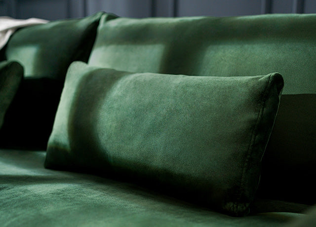 Close-up of IKEA FARLOV three-seater sofa with Classic Velvet Forest Green slipcover
