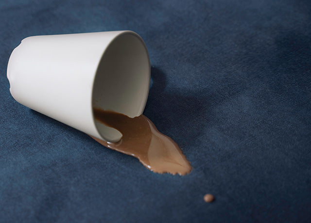 Coffee spilled on IKEA STOCKSUND armchair with spill-resistant Signature Velvet Midnight slipcover