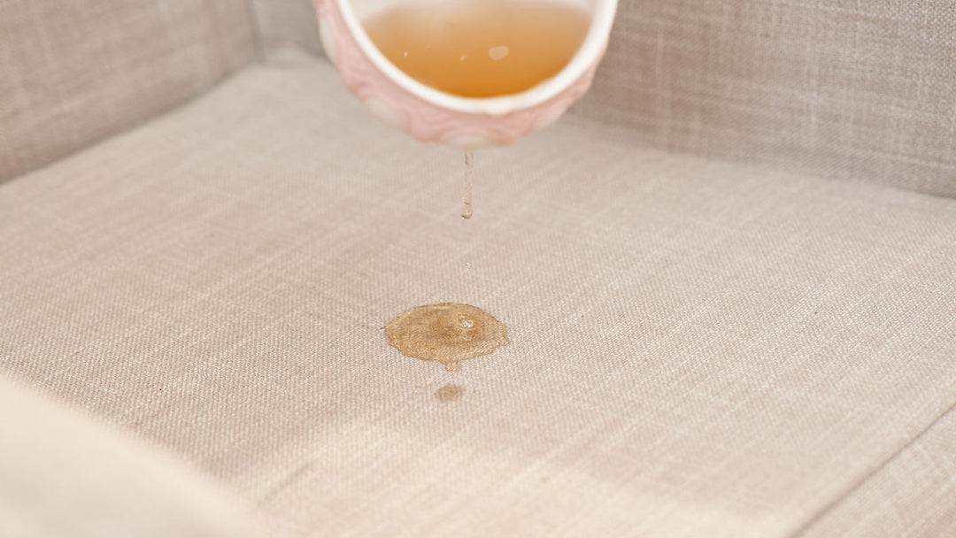 Accidental-tea-spills-on-a-ComfortWorks-performance-fabrics-liquid-repellent-coated-and-spill-resistant-Care+Linen-couch-cover-in-Natural-colour
