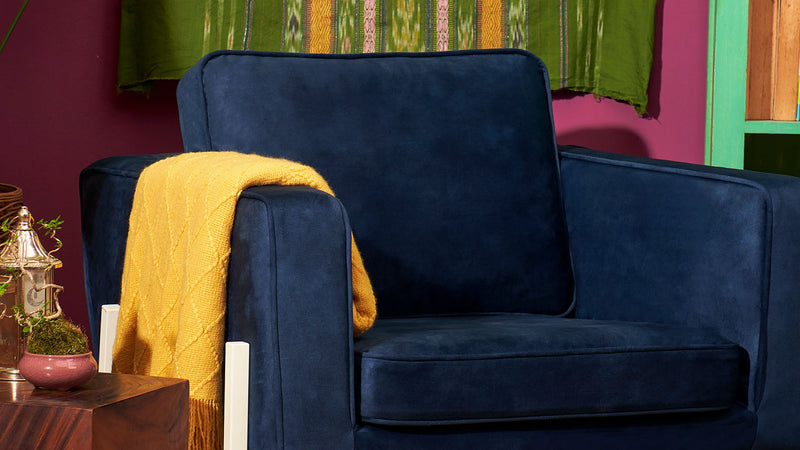Beauty-shot-of-a-single-seater-IKEA-Koarp-armchair-covered-in-ComfortWorks-performance-fabrics-SignatureVelvet-in-Midnight-colour