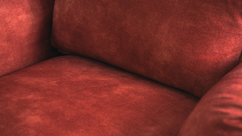 Beauty-closeup-shot-of-a-singe-seater-sofa-back-cushion-and-seat-covered-in-SignatureVelvet-in-Sunset-colour