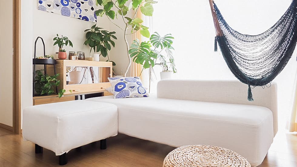 MUJI sectional sofa featuring white Cotton Canvas slipcover in a Scandinavian living room