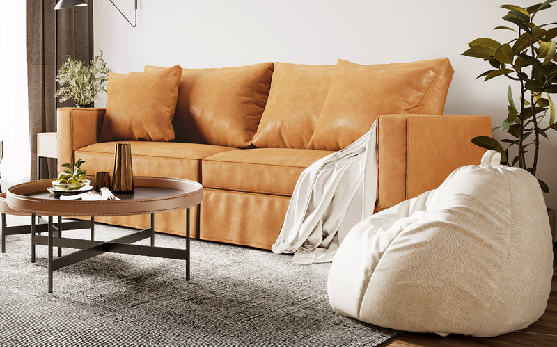 Crate and Barrel Willow sofa with spill-resistant Savannah Saddle synthetic leather slipcover in a decorated living room