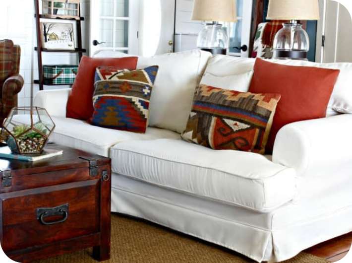 Sofa couch with custom white slipcover in an aesthetic living room