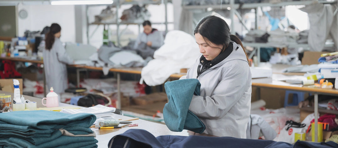 Comfort-Works-couch-covers-quality-specialist-inspecting-seams-and-panels-of sofa-covers-in-manufacturing-factory