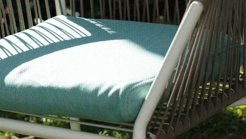 Chair-cushion-with-ComfortWorks-mould-and-mildew-protected-performance-fabrics-cushion-cover-Care+-Tweed-in-Mineral-Blue-colour-exposed-to-the-outdoor-elements-and-weather