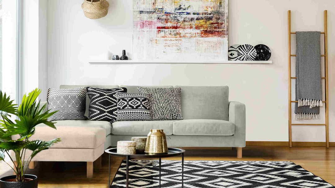 Scandinavian living room with IKEA Karlstad sofa in Performance Weave Stone and Performance Weave Cream slipcover