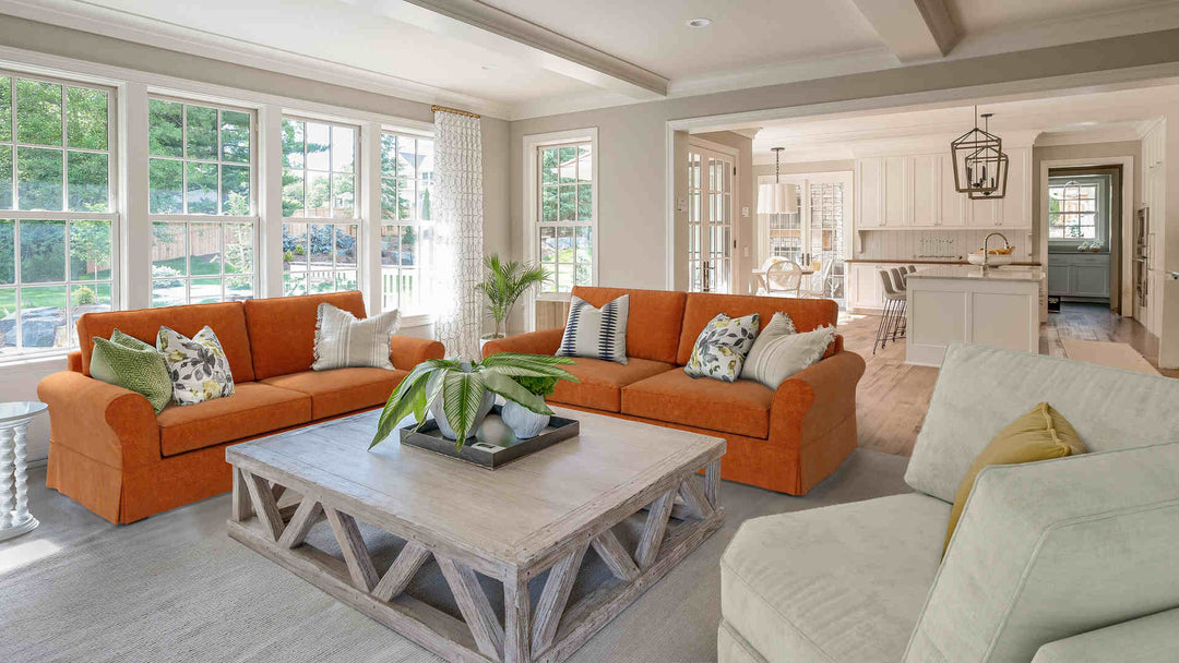 Rustic living room with Pottery Barn Comfort Roll Arm sofa in Comfort Chenille Burnt Orange and Performance Weave Stone slipcover