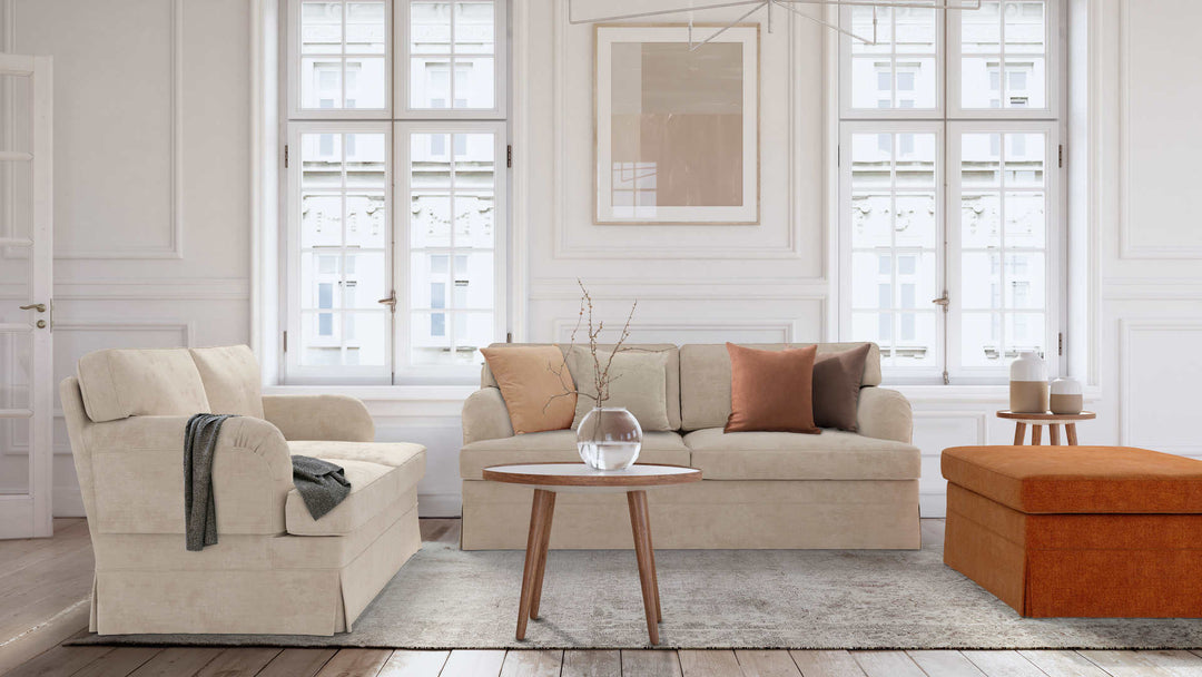 Modern Victorian living room with IKEA Stocksund sofa in Performance Weave Cream and Comfort Chenille Burnt Orange slipcover