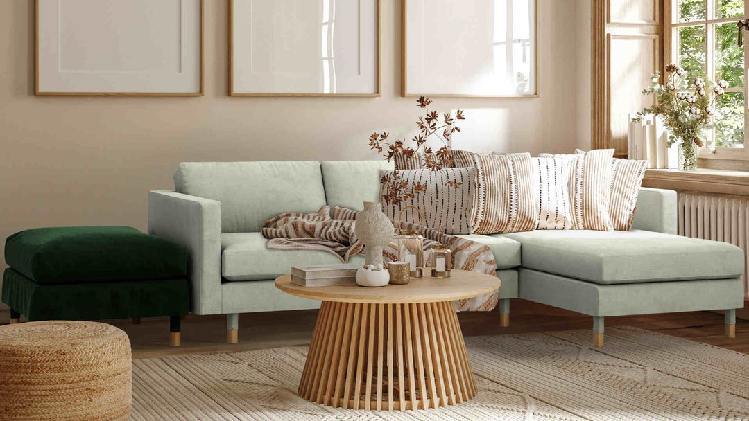 Nordic Minimalist living room with IKEA Landskrona sofa in Performance Weave Stone and Classic Velvet Forest Green slipcover