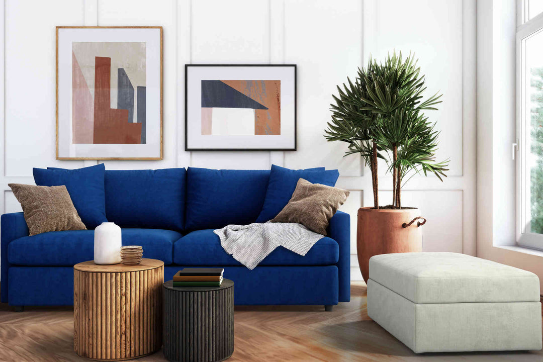 Modern Victorian living room with Crate and Barrel Lounge II sofa in Classic Velvet Cobalt and Performance Weave Stone slipcover