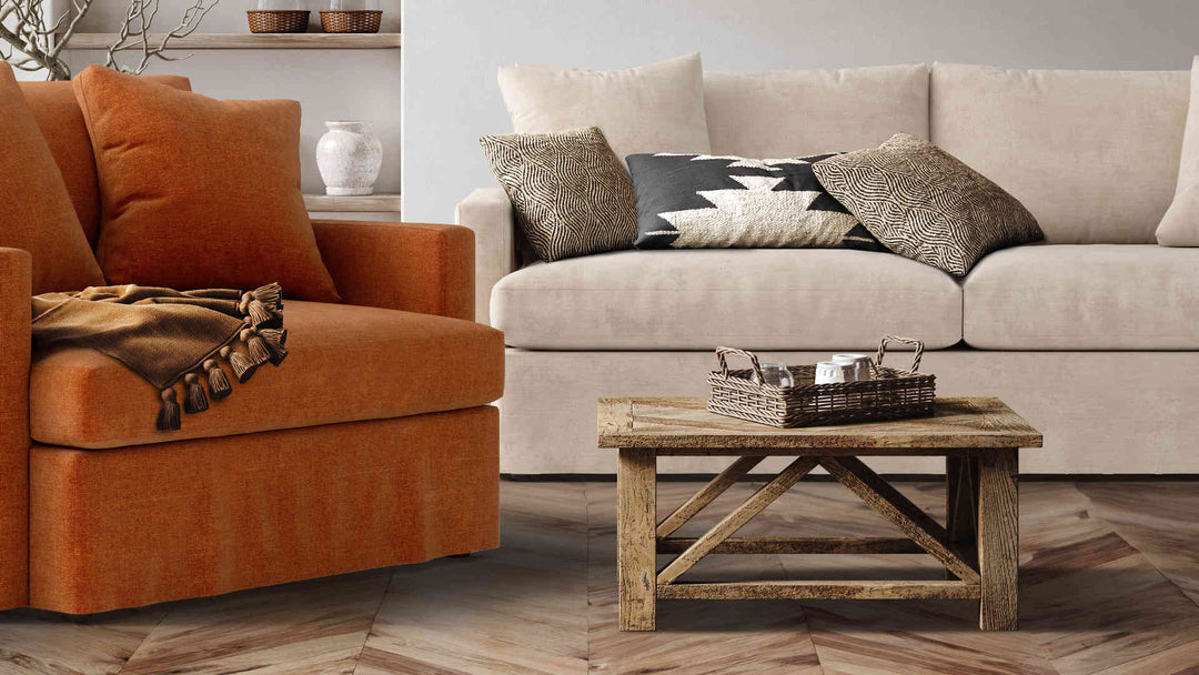 Rustic living room with Crate and Barrel Lounge II sofa in Performance Weave Cream and Comfort Chenille Burnt Orange slipcover