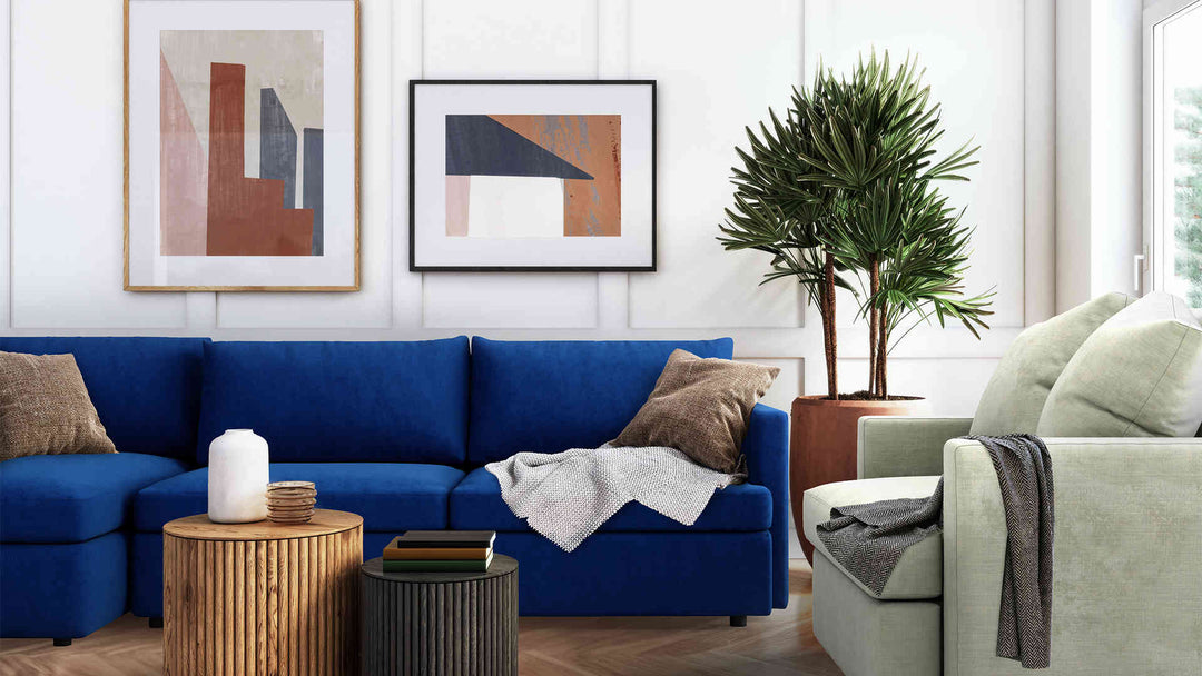 Modern Victorian living room with Crate and Barrel Lounge II sofa in Classic Velvet Cobalt and Performance Weave Stone slipcover