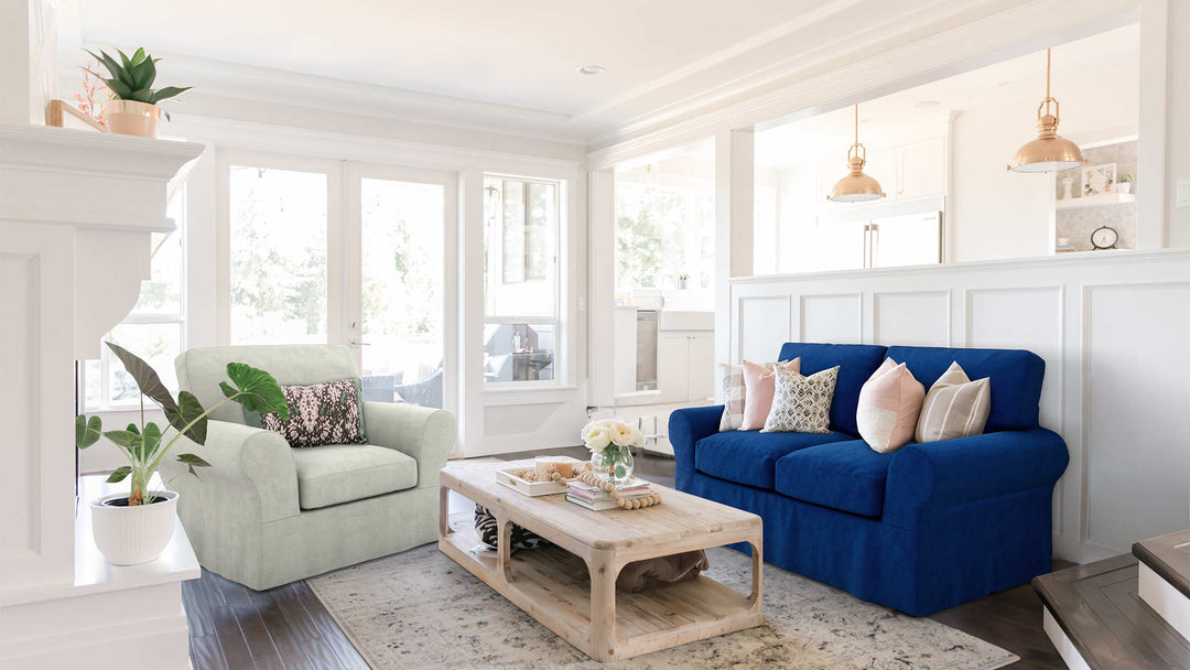 Modern Victorian living room with Pottery Barn PB Basic sofa in Classic Velvet Cobalt and Performance Weave Stone slipcover