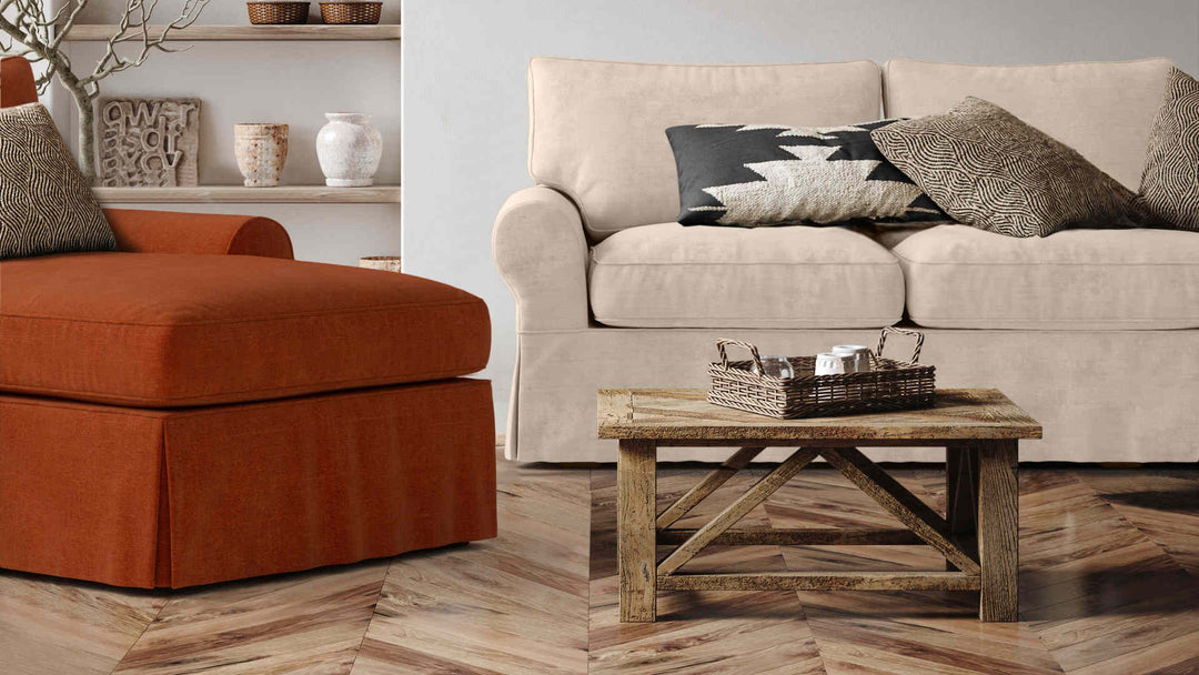 Rustic living room with Pottery Barn PB Basic sofa in Performance Weave Cream and Comfort Chenille Burnt Orange slipcover