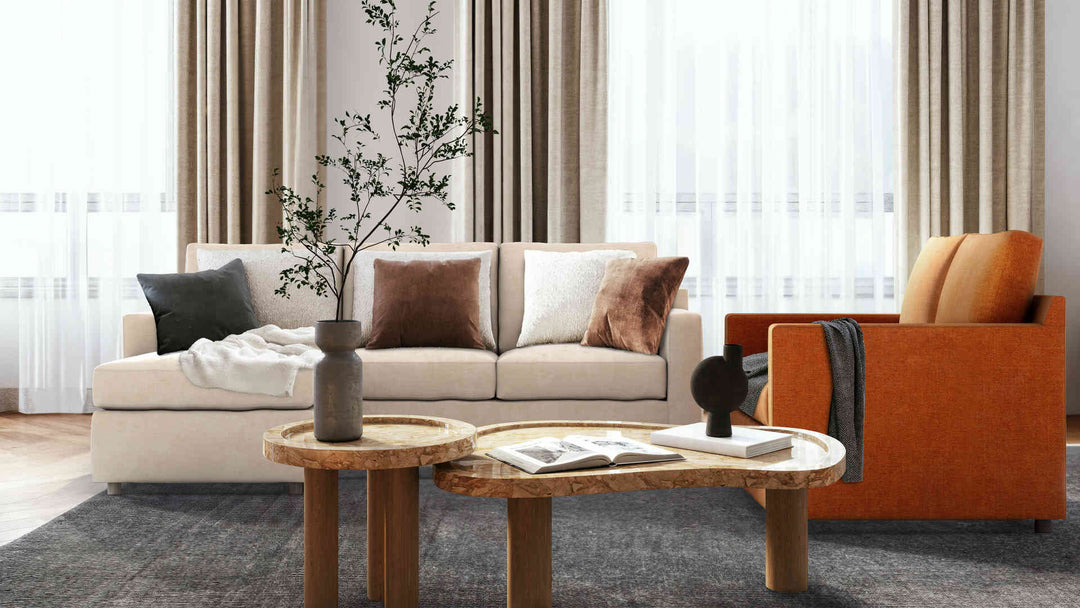 Modern living room with Crate and Barrel Barrett sofa in Performance Weave Stone and Comfort Chenille Burnt Orange slipcover