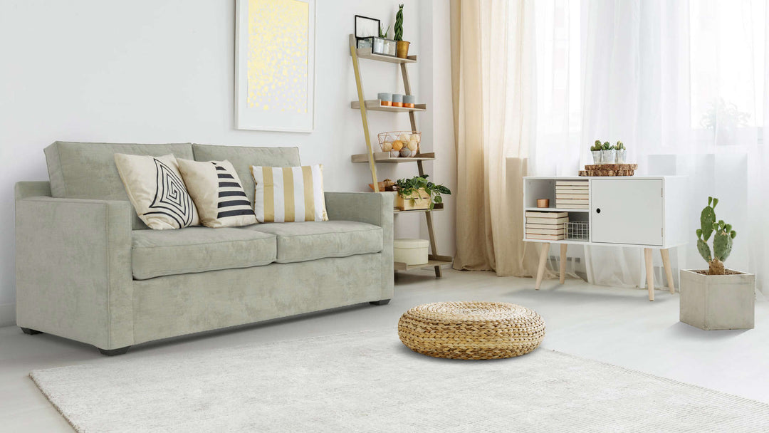 Bohemian living room with Crate and Barrel Davis sofa in Performance Weave Stone fabric slipcover