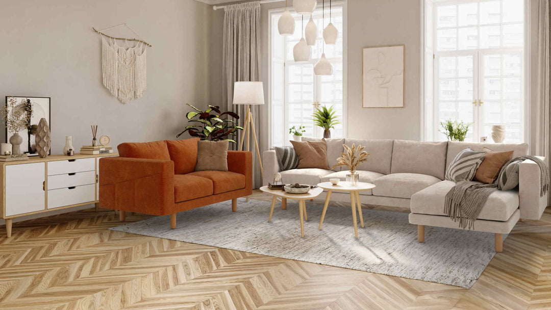 Scandinavian living room with IKEA Norsborg sofa in Performance Weave Cream and Comfort Chenille Burnt Orange slipcover