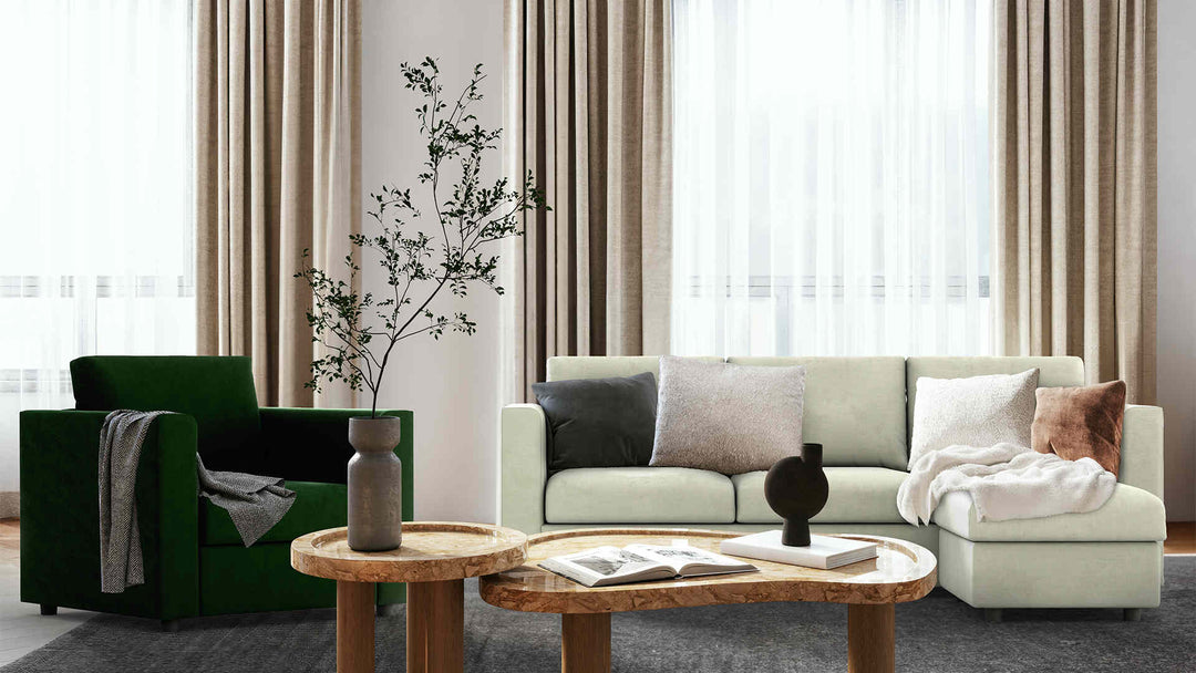 Modern living room with IKEA Finnala sofa in Performance Weave Stone and Classic Velvet Forest Green slipcover