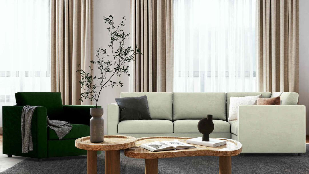 Modern living room with IKEA Finnala sofa in Performance Weave Stone and Classic Velvet Forest Green slipcover