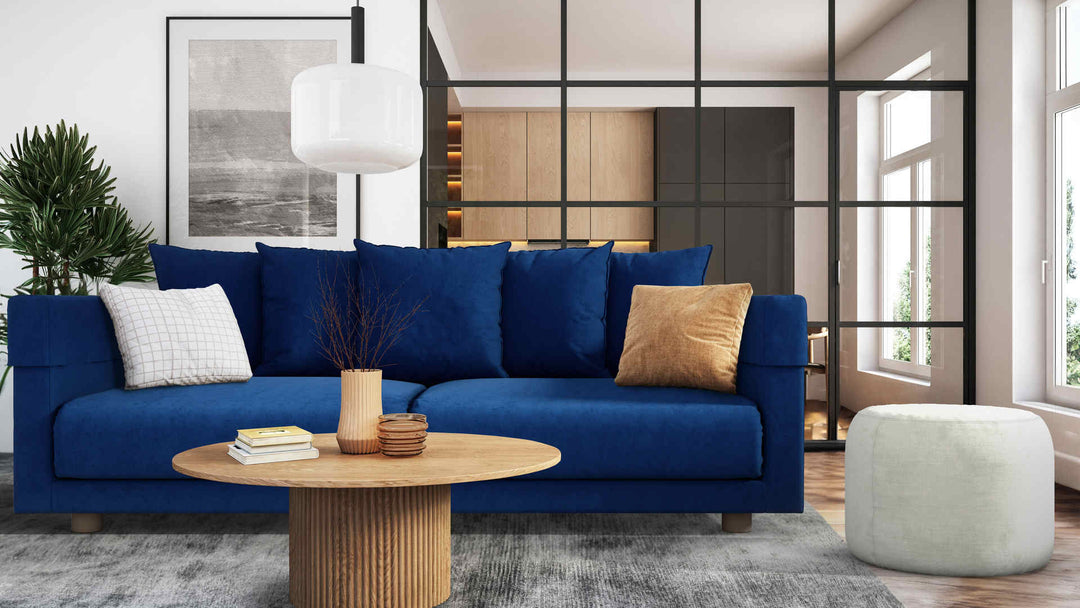 Modern living room with IKEA Stockholm sofa in Classic Velvet Cobalt and Performance Weave Stone slipcover