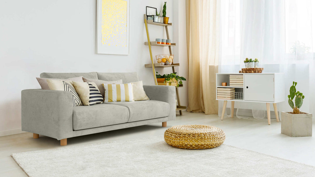 Bohemian living room with Muji Wide Arm sofa in Performance Weave Stone fabric slipcover