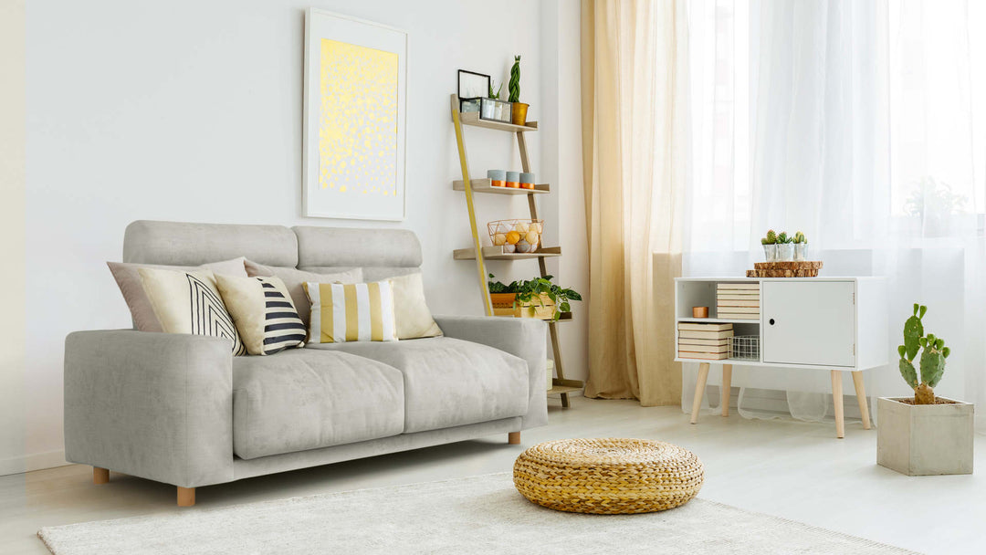 Bohemian living room with Muji Feather Pocket Coil sofa in Performance Weave Stone fabric slipcover