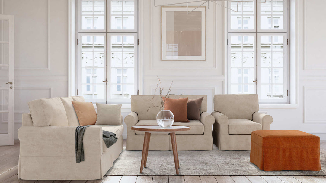 Modern Victorian living room with Rowe Nantucket sofa in Performance Weave Cream and Comfort Chenille Burnt Orange slipcover