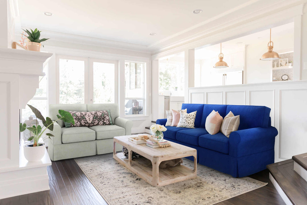 Modern Victorian living room with Rowe Nantucket sofa in Classic Velvet Cobalt and Performance Weave Stone slipcover