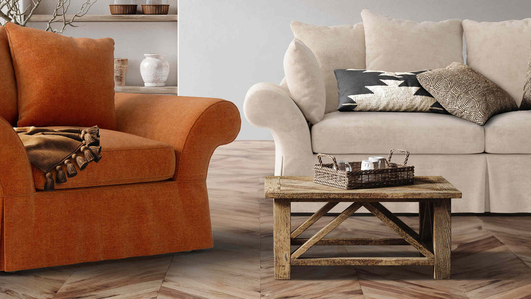 Rustic living room with Pottery Barn Charleston sofa in Performance Weave Cream and Comfort Chenille Burnt Orange slipcover