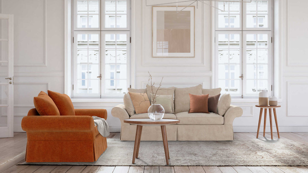 Modern Victorian living room with Pottery Barn Charleston sofa in Performance Weave Cream and Comfort Chenille Burnt Orange slipcover