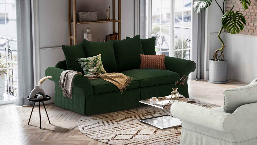 Nordic Minimalist living room with Pottery Barn Charleston sofa in Performance Weave Stone and Classic Velvet Forest Green slipcover