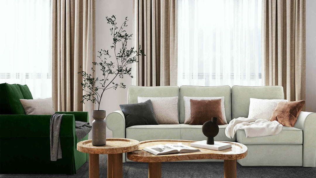 Modern living room with IKEA Backabro sofa in Performance Weave Stone and Classic Velvet Forest Green slipcover