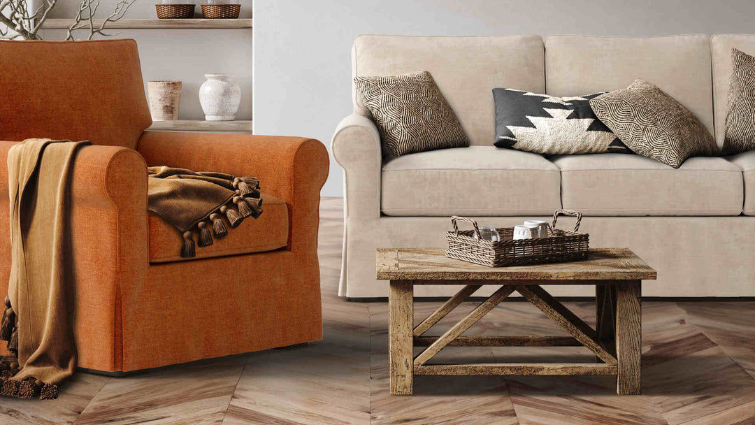 Rustic living room with Pottery Barn Buchanan Roll Arm sofa in Performance Weave Cream and Comfort Chenille Burnt Orange slipcover