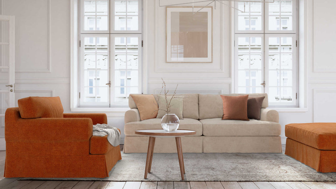 Modern Victorian living room with IKEA Hovas sofa in Performance Weave Cream and Comfort Chenille Burnt Orange slipcover