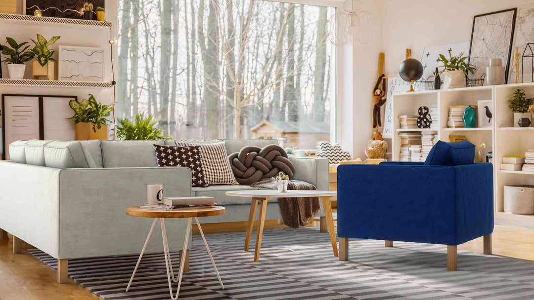 Bohemian living room with IKEA Karlanda sofa in Performance Weave Stone and Classic Velvet Cobalt slipcover