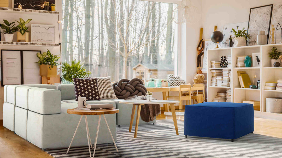 Bohemian living room with IKEA Kungshamn sofa in Performance Weave Stone and Classic Velvet Cobalt slipcover