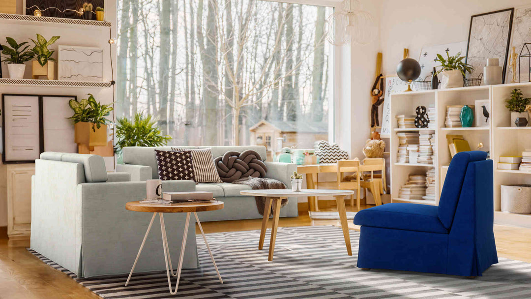 Bohemian living room with IKEA Sandby sofa in Performance Weave Stone and Classic Velvet Cobalt slipcover