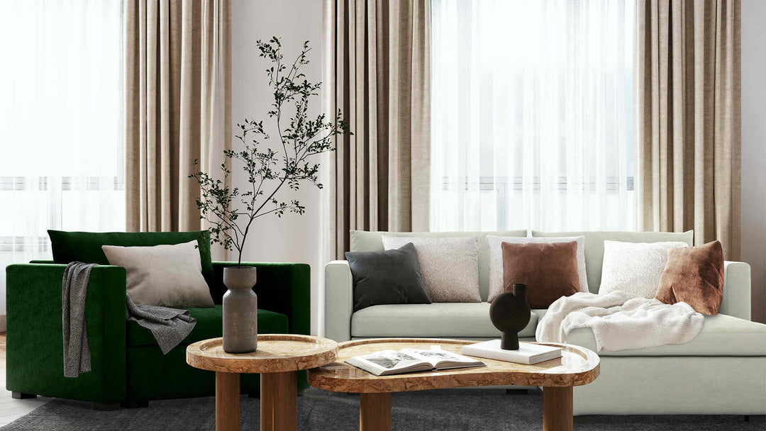 Modern living room with IKEA Vaxholm sofa in Performance Weave Stone and Classic Velvet Forest Green slipcover
