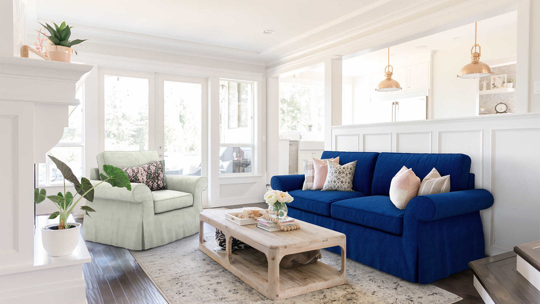 Modern Victorian living room with Pottery Barn Pearce Roll Arm sofa in Classic Velvet Cobalt and Performance Weave Stone slipcover