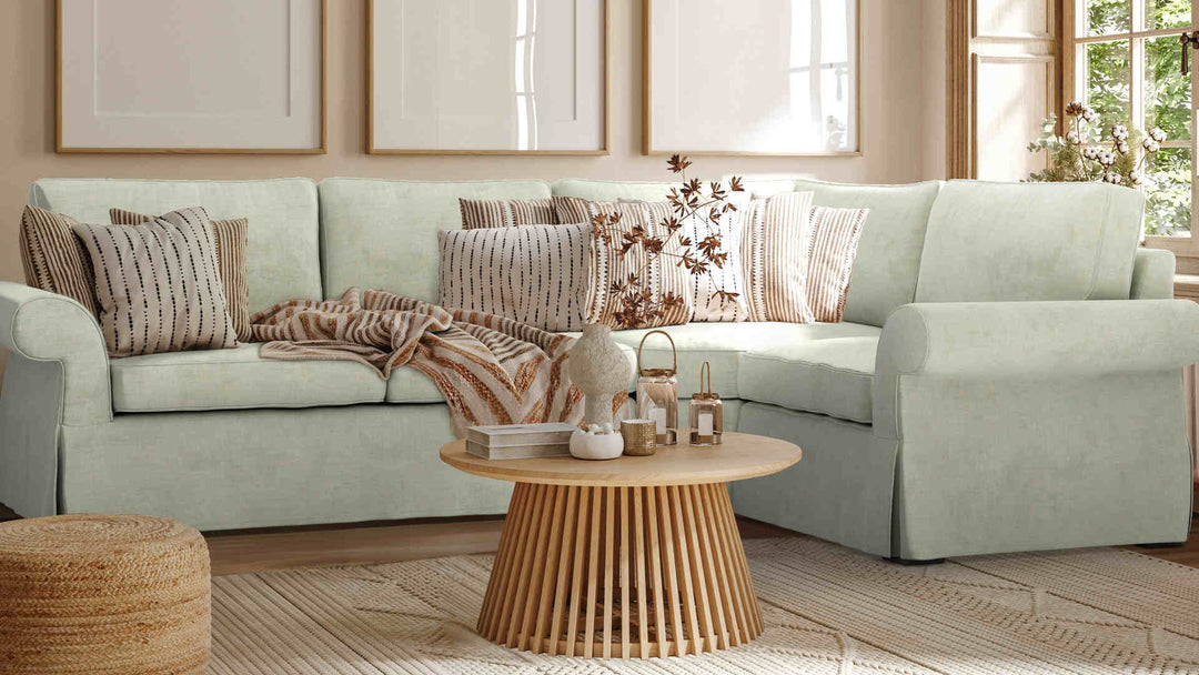 Nordic Minimalist living room with Pottery Barn Pearce Roll Arm sofa in Performance Weave Stone slipcover
