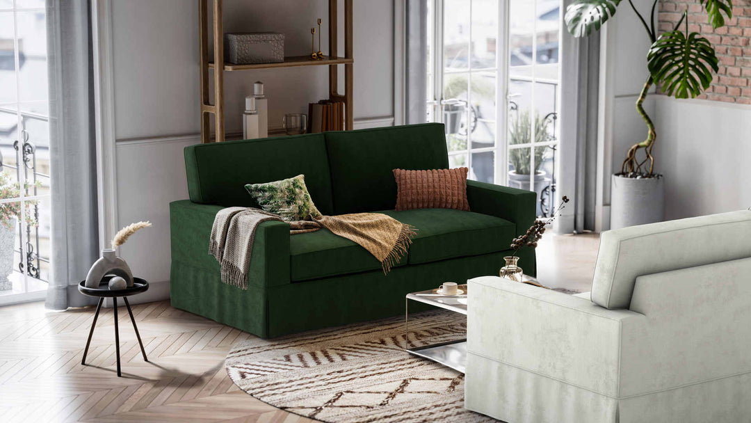 Nordic Minimalist living room with Pottery Barn Comfort Square Arm sofa in Performance Weave Stone and Classic Velvet Forest Green slipcover