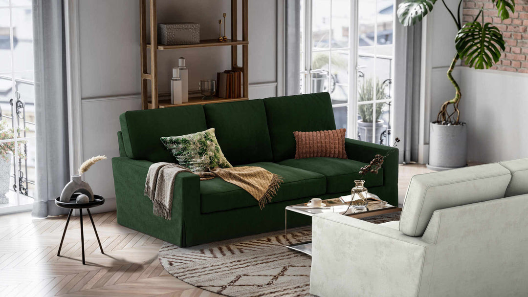 Nordic Minimalist living room with Pottery Barn Turner Square Arm sofa in Performance Weave Stone and Classic Velvet Forest Green slipcover