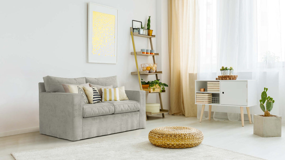 Bohemian living room with Pottery Barn PB Square sofa in Performance Weave Stone fabric slipcover